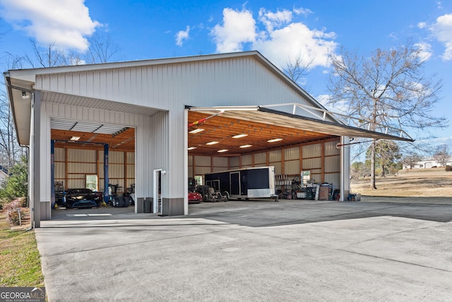 exterior space with a garage and a pole building