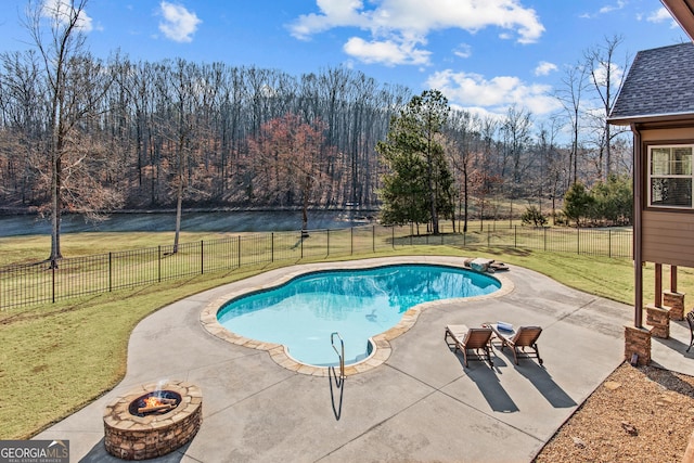 view of pool with an outdoor fire pit, a fenced backyard, a patio, and a yard