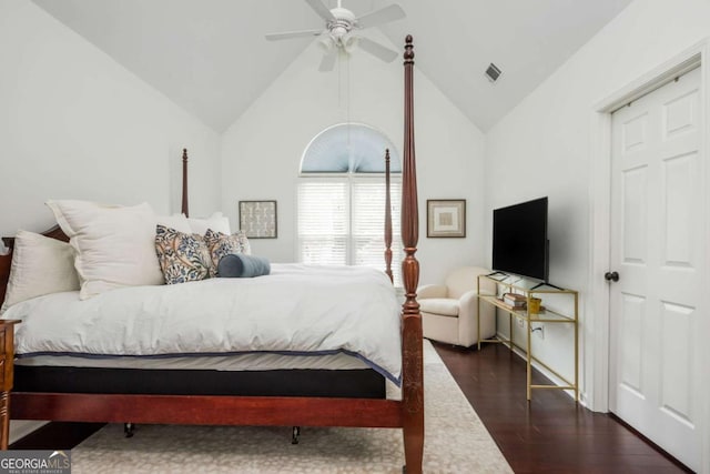 bedroom featuring lofted ceiling, a ceiling fan, visible vents, and wood finished floors