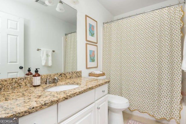 full bath with toilet, visible vents, and vanity