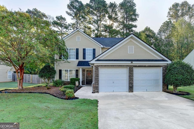 traditional-style home featuring brick siding, an attached garage, fence, driveway, and a front lawn