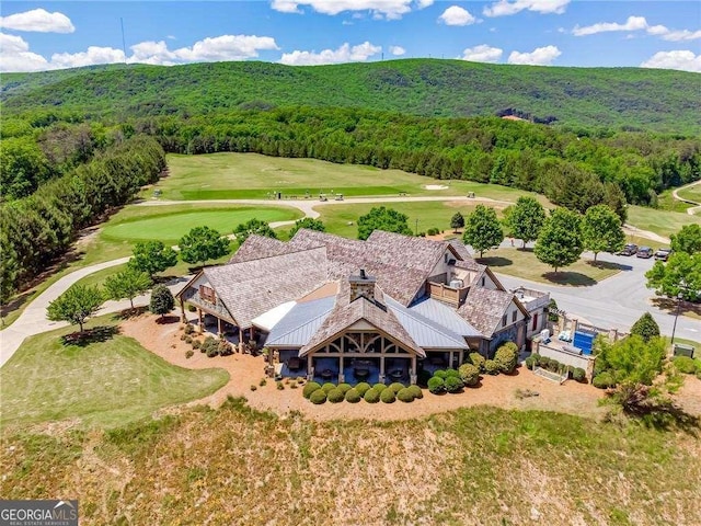 bird's eye view featuring a forest view