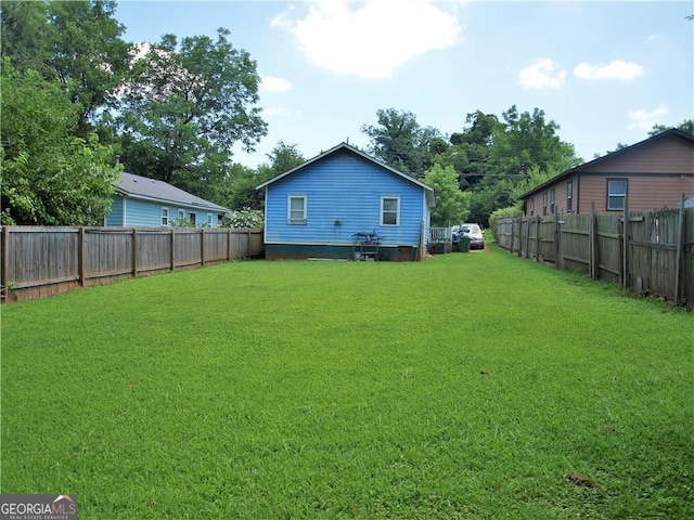 view of yard with a fenced backyard