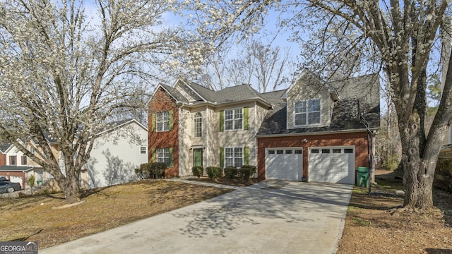 traditional-style house with concrete driveway, brick siding, an attached garage, and roof with shingles