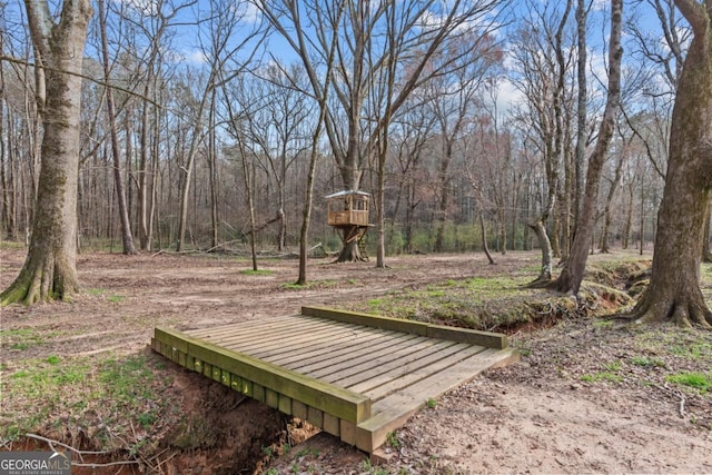 view of home's community featuring a view of trees