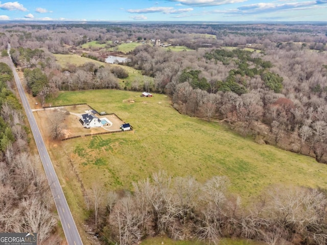 aerial view featuring a view of trees