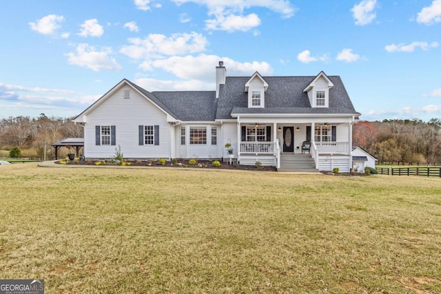 cape cod-style house with a porch, a front lawn, a chimney, and fence