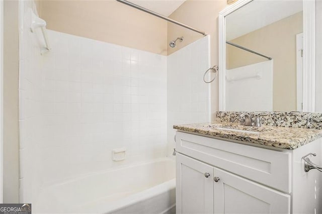 bathroom featuring shower / bathing tub combination and vanity