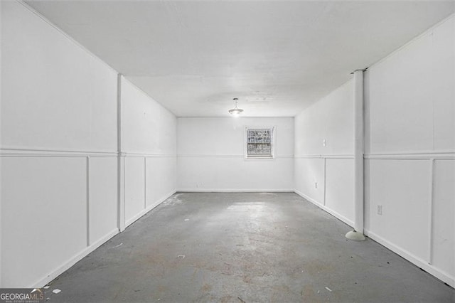 spare room featuring unfinished concrete floors