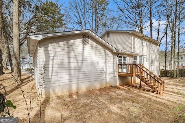 view of property exterior with stairway