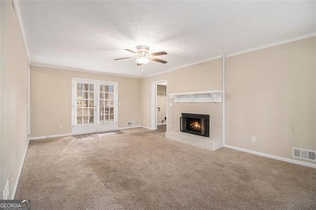 unfurnished living room featuring carpet, visible vents, and ornamental molding