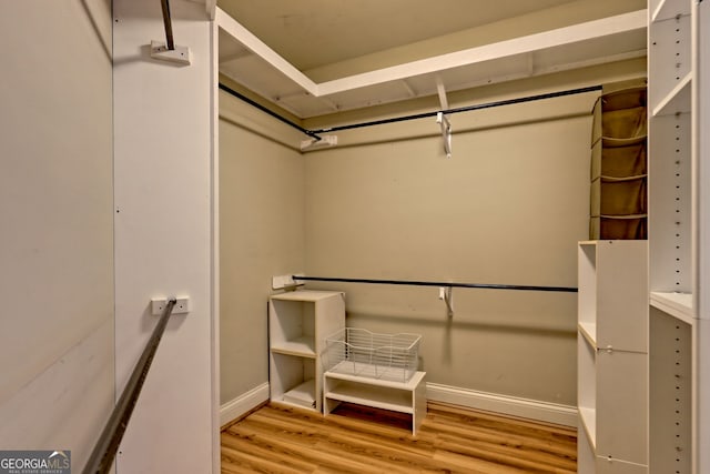 116 Smoky Mountain Ln Unit 103, Clayton, GA 30525 - walk in closet featuring wood finished floors