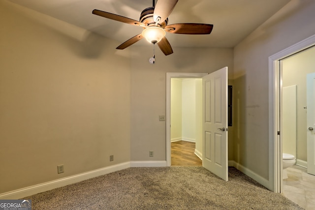 116 Smoky Mountain Ln Unit 103, Clayton, GA 30525 - unfurnished bedroom featuring ensuite bath, light colored carpet, and ceiling fan