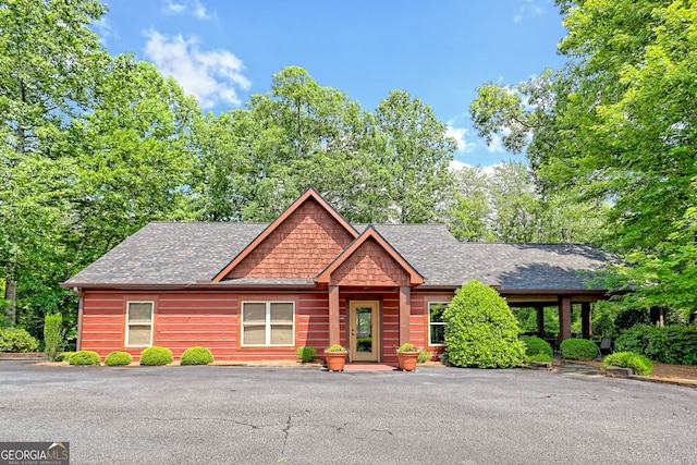 116 Smoky Mountain Ln Unit 103, Clayton, GA 30525 - rustic home with a shingled roof and driveway