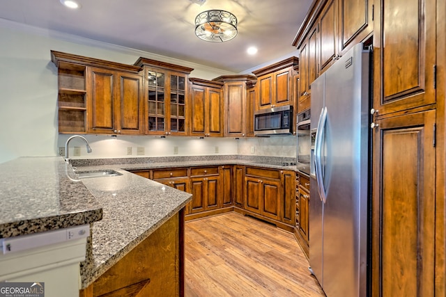 116 Smoky Mountain Ln Unit 103, Clayton, GA 30525 - kitchen with appliances with stainless steel finishes, open shelves, dark stone countertops, light wood finished floors, and glass insert cabinets