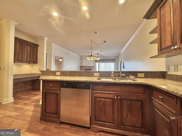 kitchen featuring a sink, light stone countertops, ornamental molding, and stainless steel dishwasher