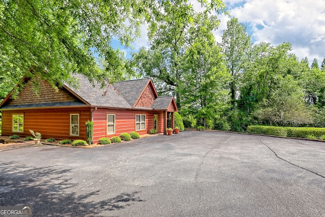 116 Smoky Mountain Ln Unit 103, Clayton, GA 30525 - view of side of property with asphalt driveway and roof with shingles