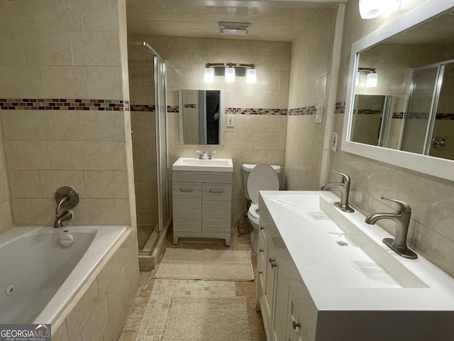 bathroom with tasteful backsplash, a relaxing tiled tub, a shower stall, and tile walls