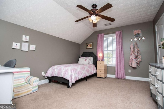 carpeted bedroom featuring lofted ceiling, a textured ceiling, a ceiling fan, and baseboards