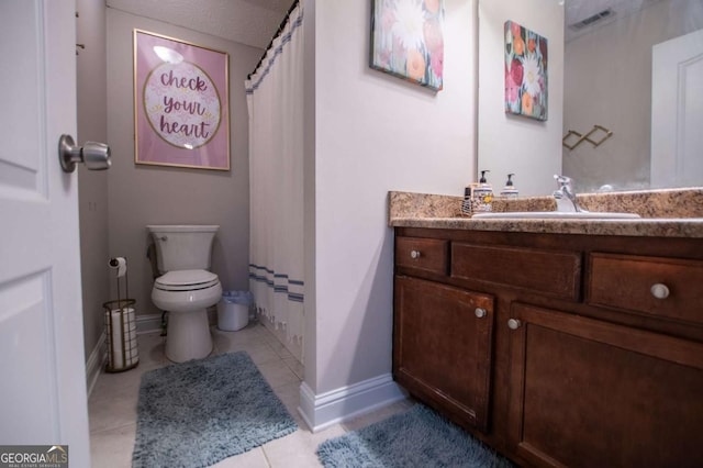 bathroom with curtained shower, tile patterned flooring, toilet, vanity, and baseboards