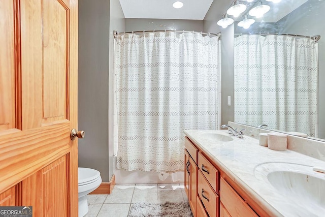 full bathroom featuring toilet, a sink, tile patterned floors, double vanity, and shower / bath combo