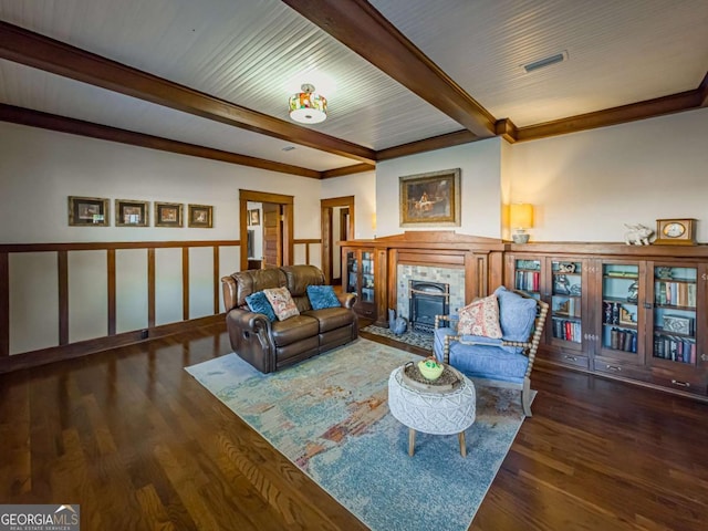 living room featuring visible vents, beamed ceiling, and wood finished floors