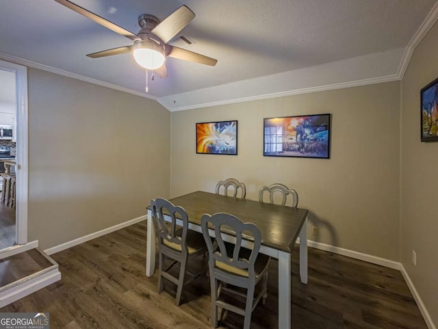 dining space featuring visible vents, ornamental molding, ceiling fan, wood finished floors, and baseboards