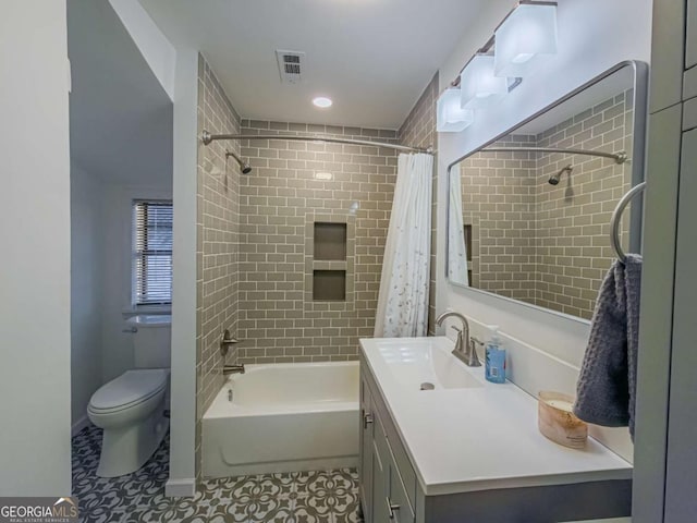 full bathroom with toilet, tile patterned flooring, visible vents, and vanity