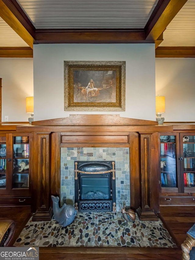 room details with wood ceiling, a fireplace, beam ceiling, and wood finished floors