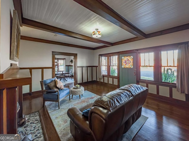 living room featuring hardwood / wood-style flooring and beam ceiling