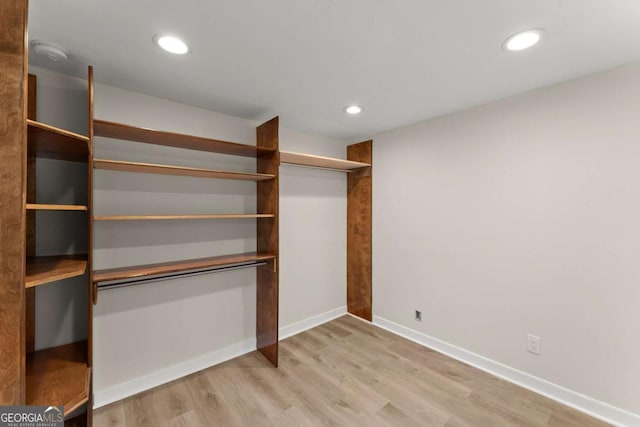 spacious closet with light wood-style flooring