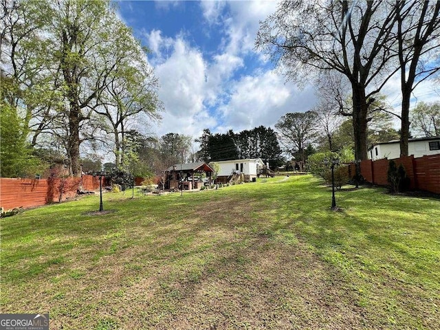 view of yard featuring fence