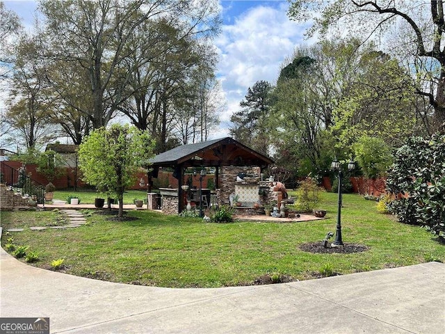 view of community featuring a gazebo and a lawn