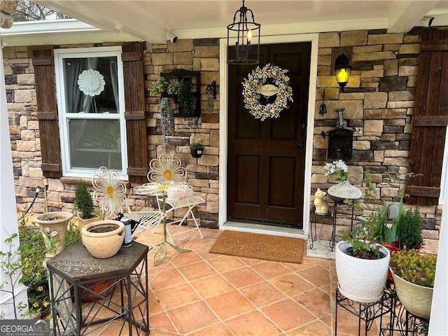 entrance to property featuring stone siding