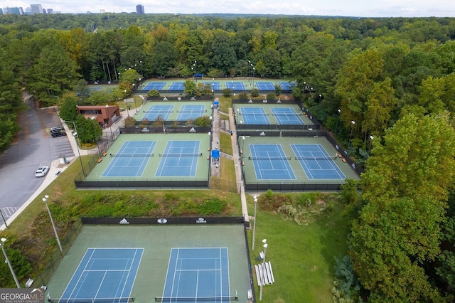 drone / aerial view featuring a forest view