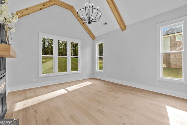 unfurnished living room with wood finished floors, visible vents, baseboards, beam ceiling, and an inviting chandelier