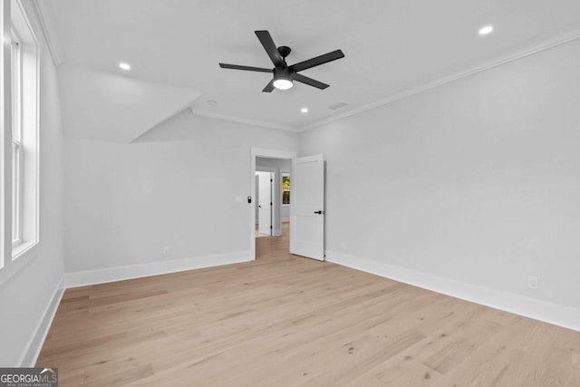 unfurnished bedroom featuring baseboards, crown molding, recessed lighting, and light wood-style floors