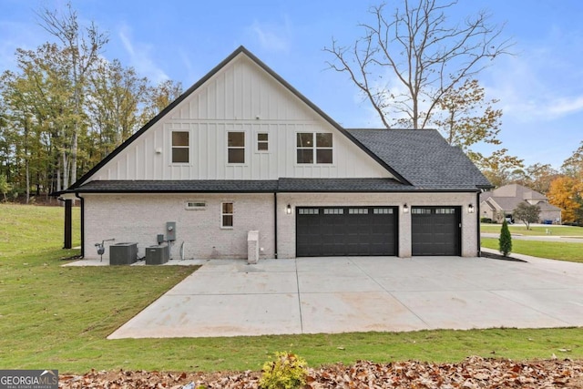 view of side of home featuring brick siding, a shingled roof, concrete driveway, a lawn, and central AC unit