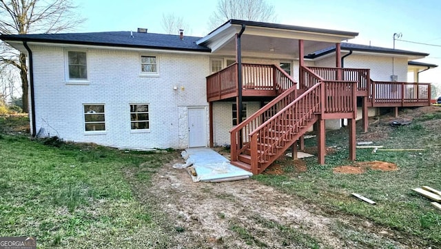 730 Keys Ferry Rd, Jackson, GA 30233 - rear view of property with a wooden deck, brick siding, a yard, and stairway