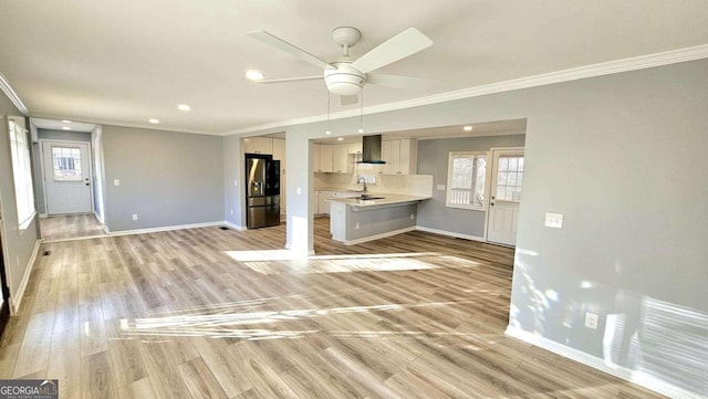 730 Keys Ferry Rd, Jackson, GA 30233 - unfurnished living room featuring crown molding, ceiling fan, light wood-type flooring, healthy amount of natural light, and recessed lighting