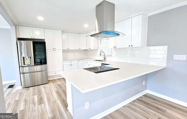 730 Keys Ferry Rd, Jackson, GA 30233 - kitchen featuring stainless steel refrigerator with ice dispenser, island exhaust hood, crown molding, a peninsula, and light wood-style flooring