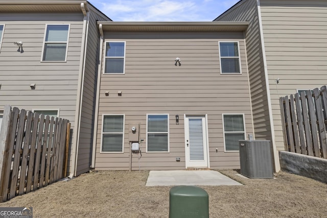 back of property featuring a patio area, fence, and central air condition unit