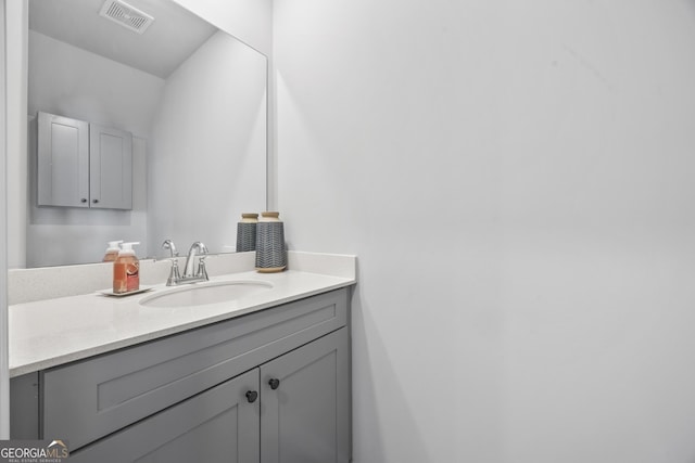 bathroom with visible vents and vanity