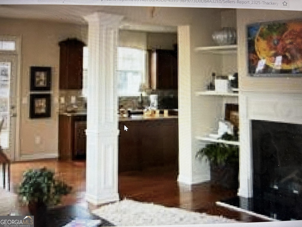 interior space featuring a glass covered fireplace