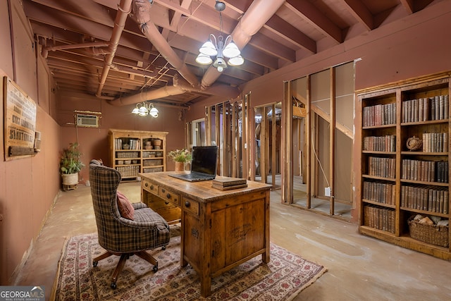 home office featuring an inviting chandelier and a wall mounted air conditioner