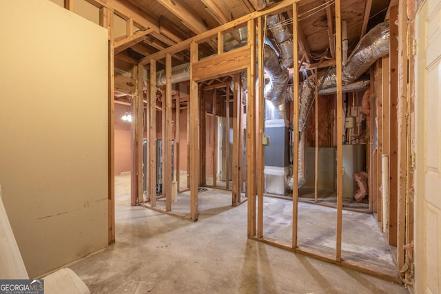 miscellaneous room with heating unit and water heater