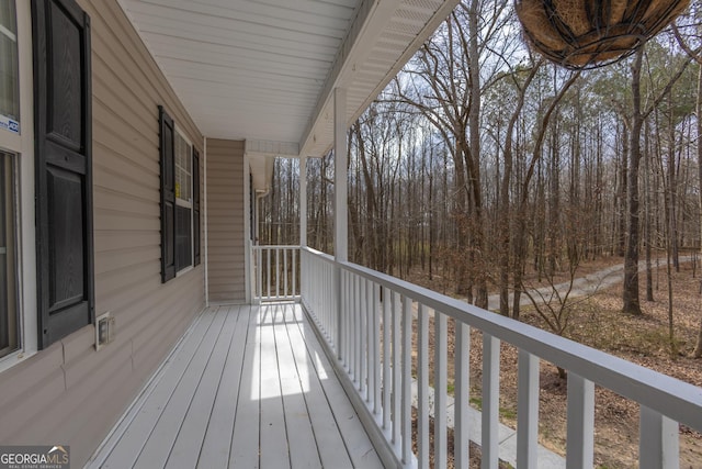 wooden terrace with a porch