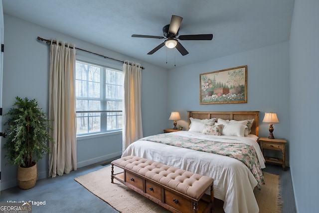 carpeted bedroom featuring ceiling fan and baseboards