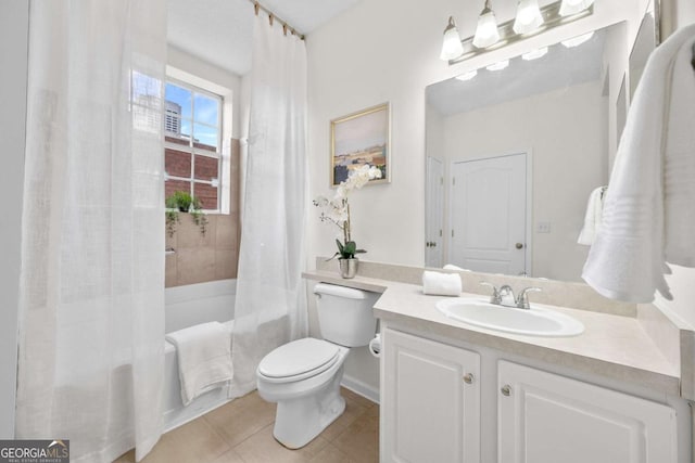 bathroom with toilet, shower / tub combo, vanity, and tile patterned floors