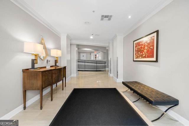 hall featuring visible vents, crown molding, and baseboards